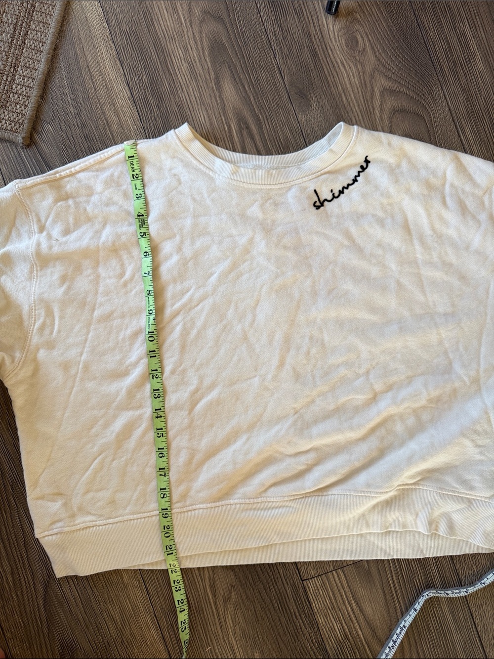 This cream Pilcro embroidered sweatshirt from Anthropologie features a "shimmer - Picture 10 of 12